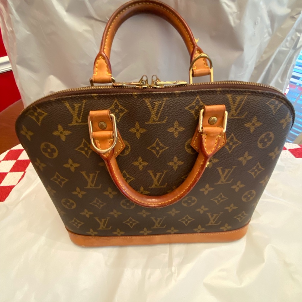 LOUIS. VUITTON MONOGRAMMED ALMA HANDBAG